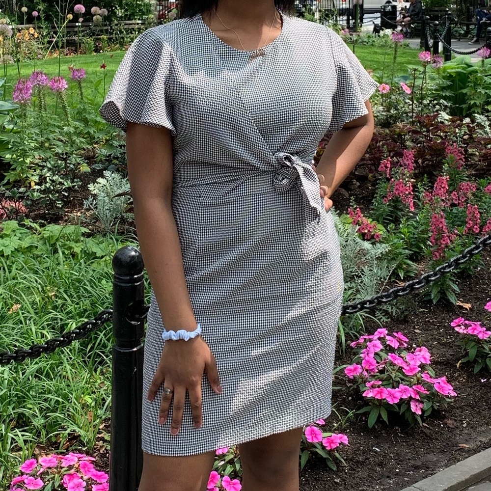 Francesca’s black and white checkered wrap dress